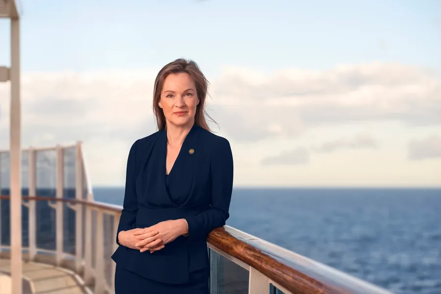 Anna Nash, President of Explora Journeys, at the rail of a ship