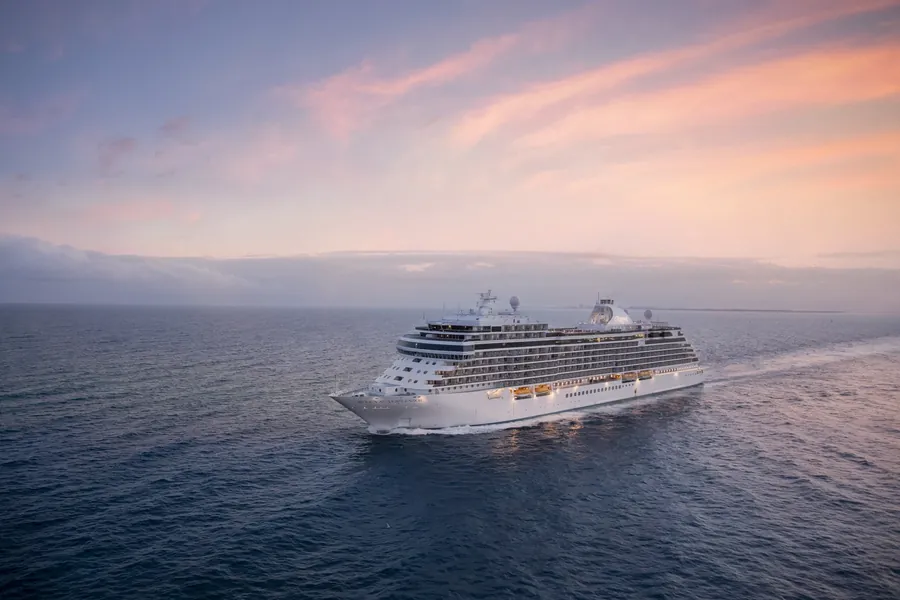 Regent Seven Seas Cruises ship Seven Seas Splendor at sea at dusk, seen from the air