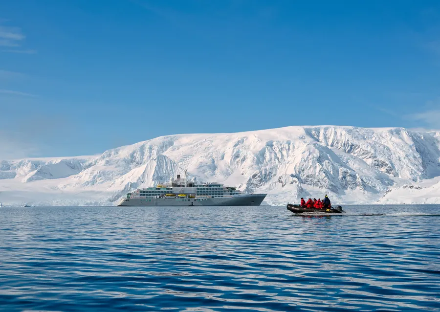 Silversea expedition ship Silver Endeavour with a Zodiac in Wilhelmina Bay, Antarctica